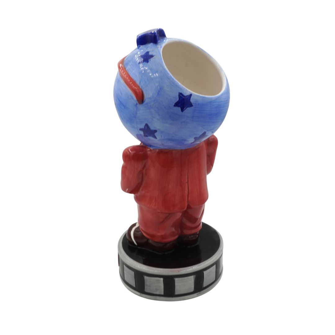 Decorative figurine with a blue spherical head and red body on a white background