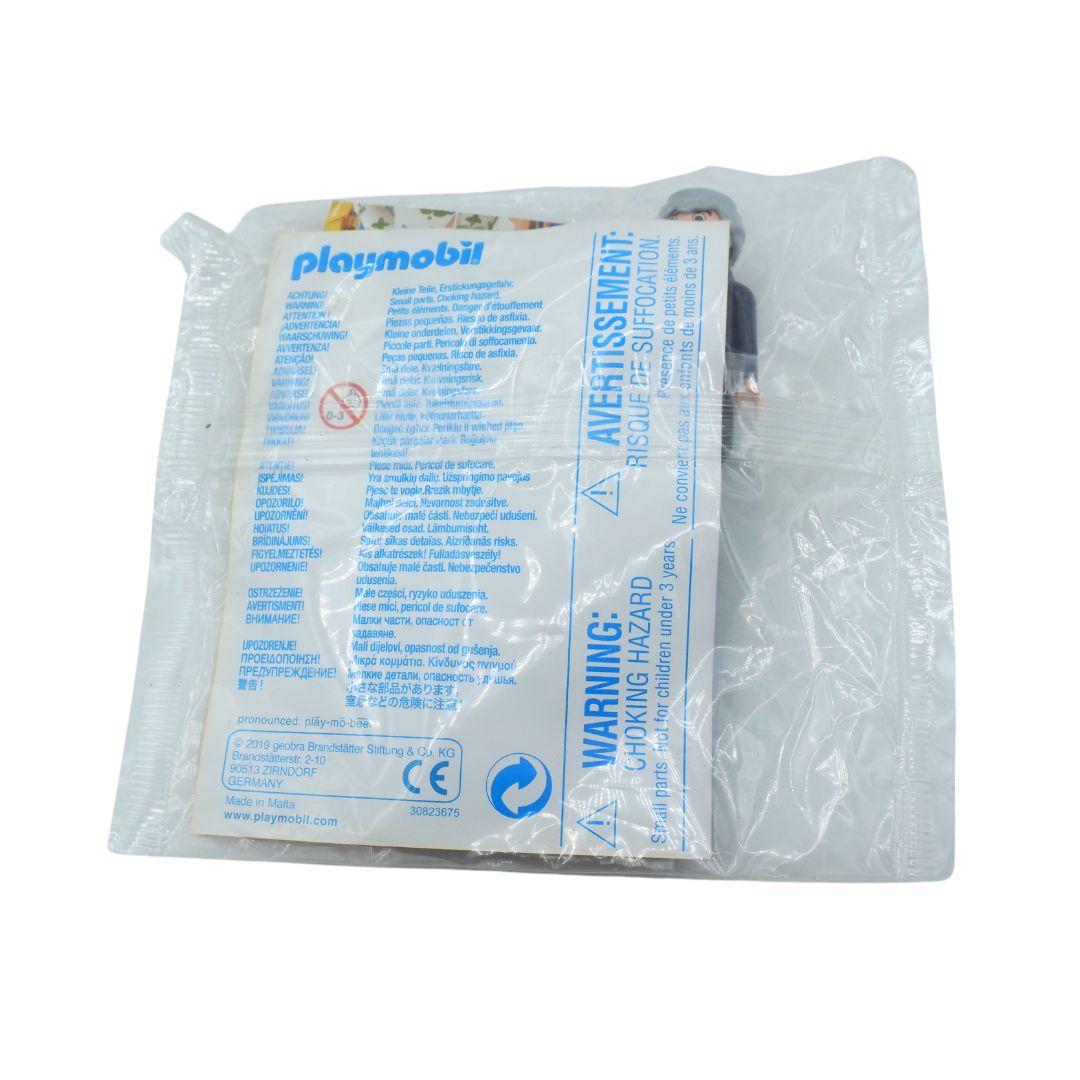 A Playmobil plastic toy accessory sealed in a clear plastic bag with a printed white insert card showing blue text and warning labels. The card shows the Playmobil logo and product details.