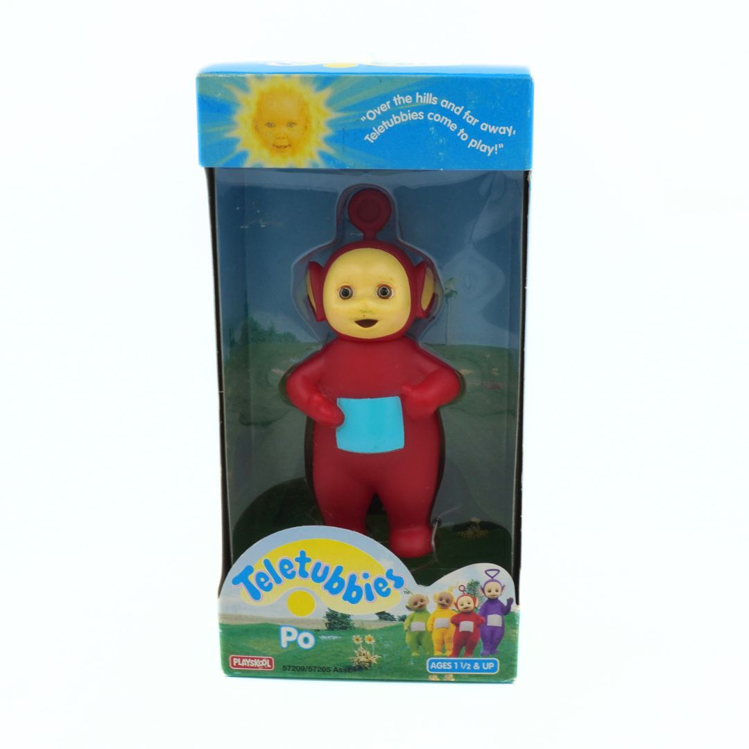 Red Teletubbies character figure in packaging with 'Teletubbies' branding.