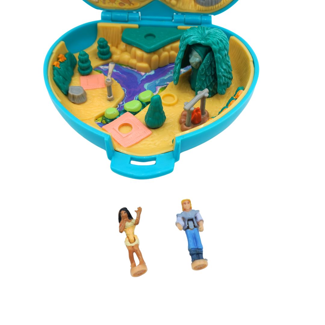 Interior of a 1995 Bluebird Polly Pocket Pocahontas playset showing a river, trees and two small figures.