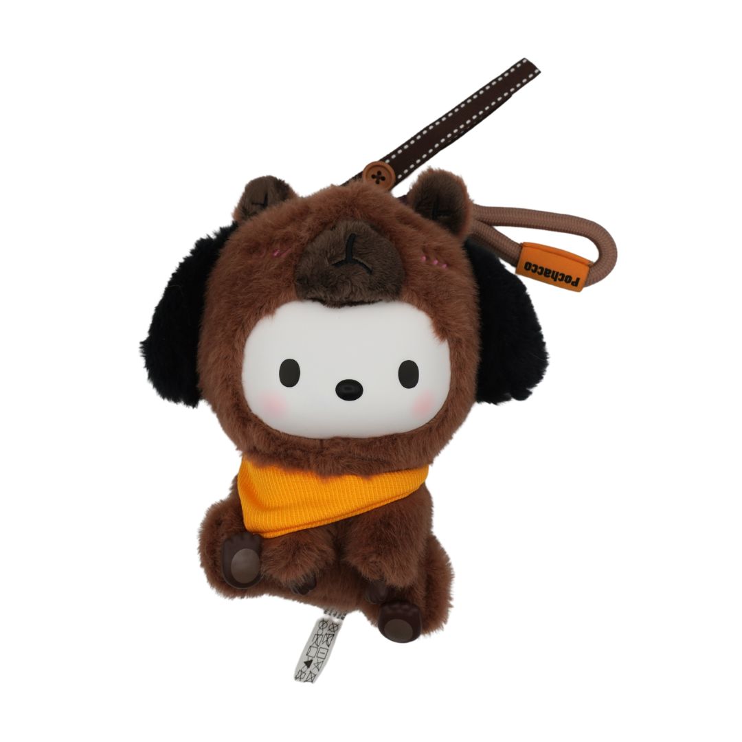 A brown plush dog keychain or bag charm with a white face, black ears, and an orange bandana, shown on a plain white background.