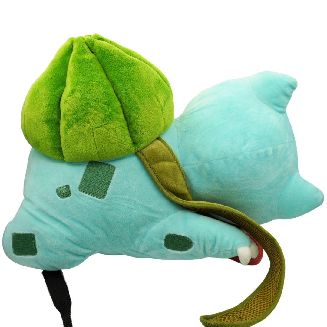 Plush toy resembling a turtle with a green shell on a white background