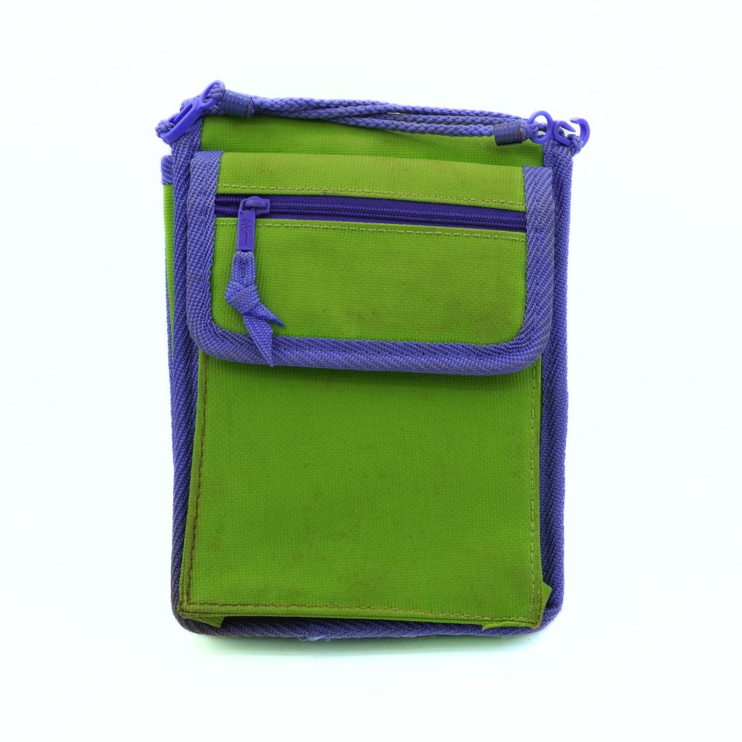 Green pouch with purple zipper on a white background