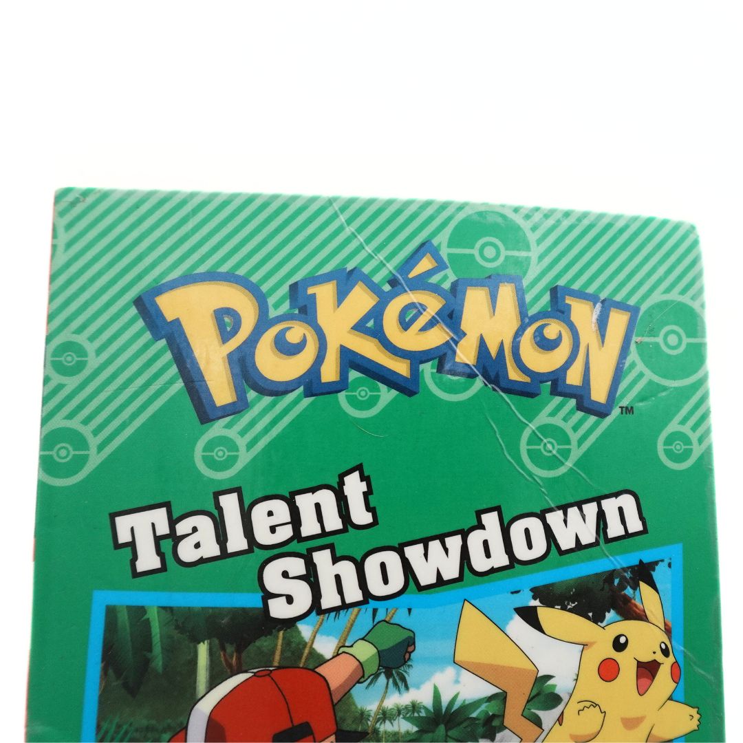 Creasing on the front cover of the 2016 Pokemon Talent Showdown paperback book