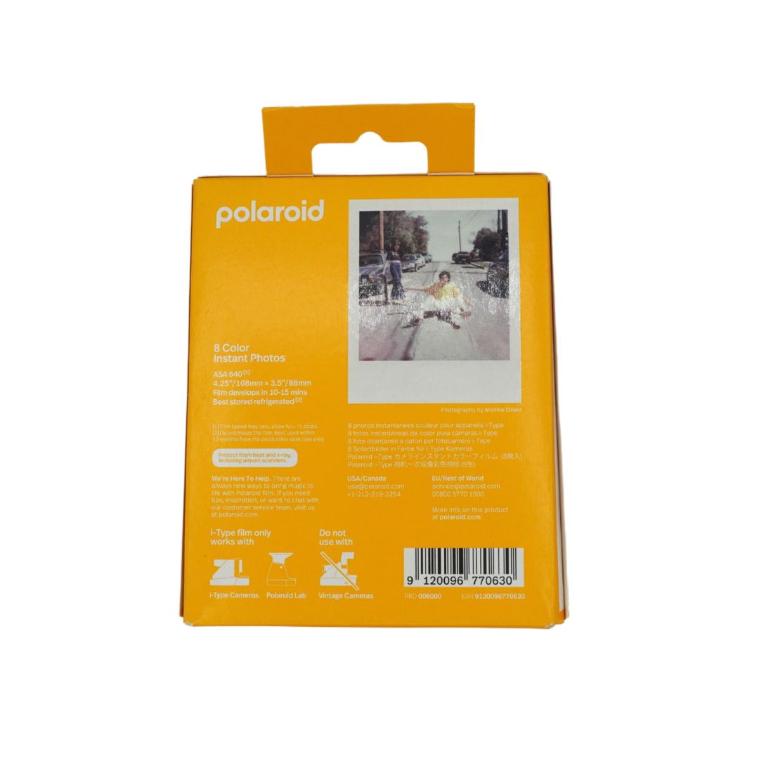 Polaroid instant photo paper packaging box in a bright orange-yellow color, showing the back side with product details, a sample instant photo, and a barcode on a white background.