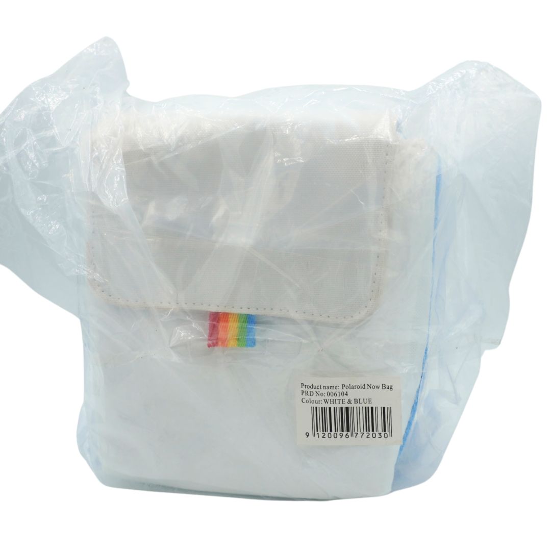 A white reusable storage bag or pouch wrapped in a clear plastic protective bag, with a small rainbow-colored tab on the front and a barcode label near the bottom.