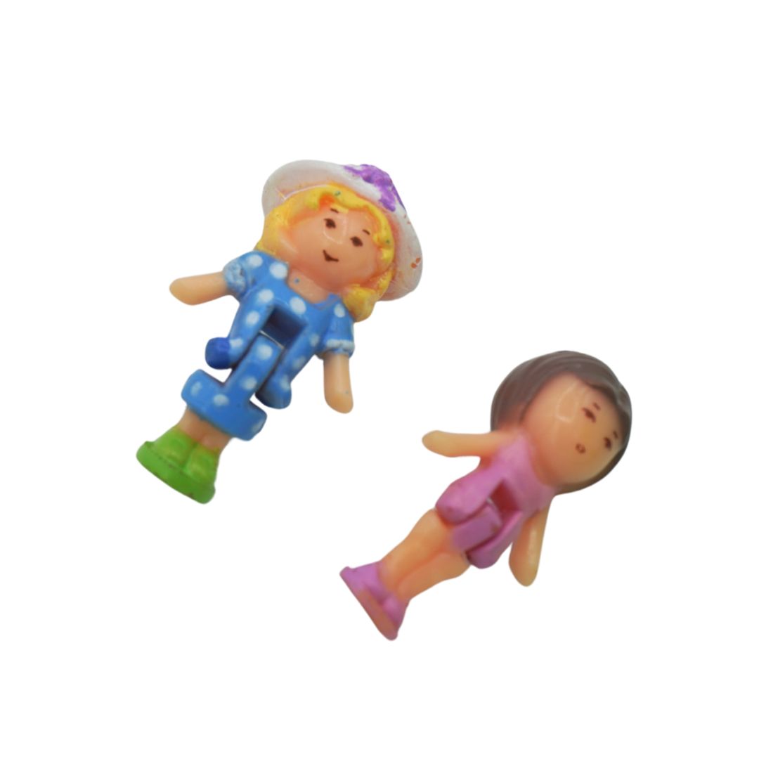 Two colorful toy figures on a white background