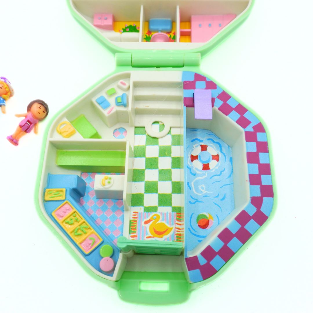 Colorful toy maze with various sections on a white background