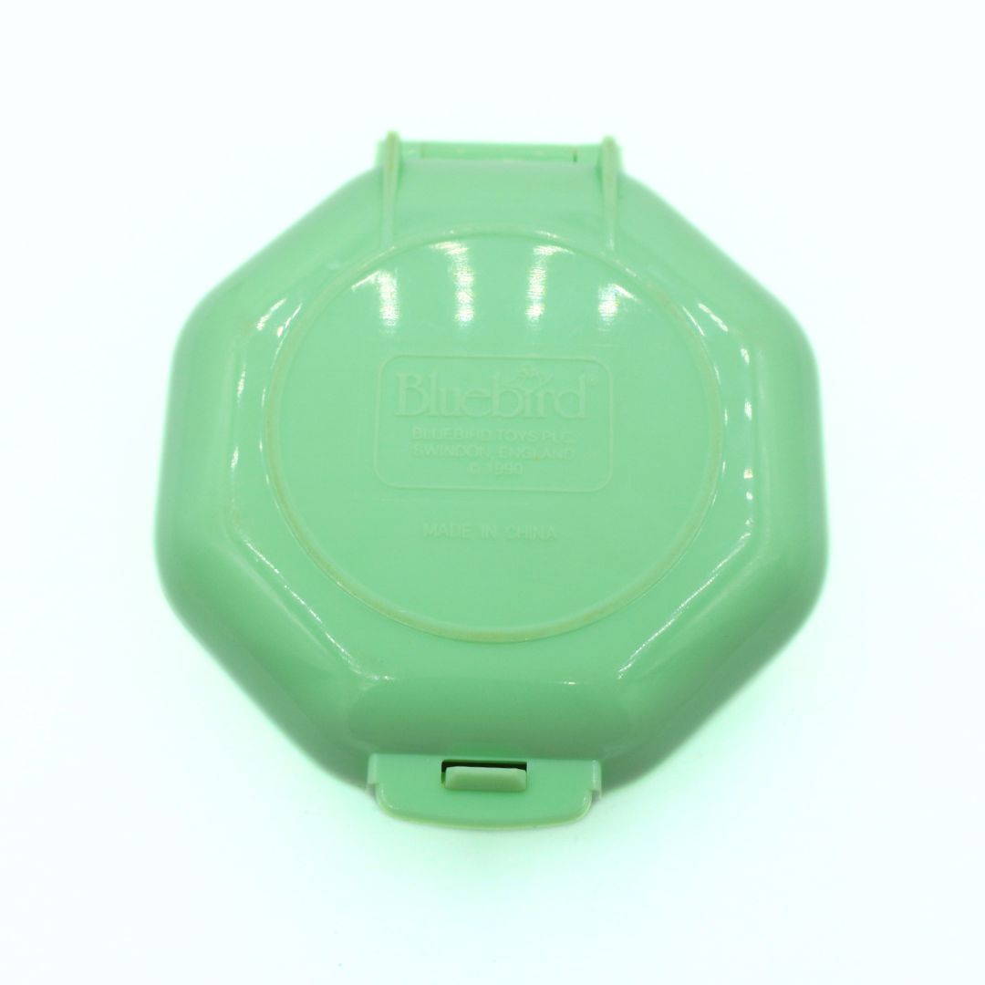 Green plastic lid on a white background