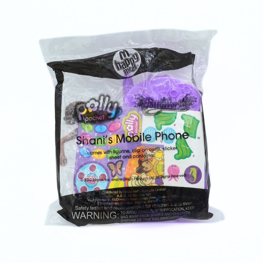 Plastic bag with colourful graphics and text, featuring the McDonald's Happy Meal logo and hosting a Polly Pocket toy