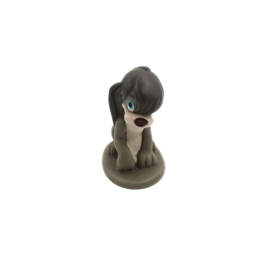 Photo of a 1998 Burger King toy of Pooka, a grey dog from the movie Anastasia