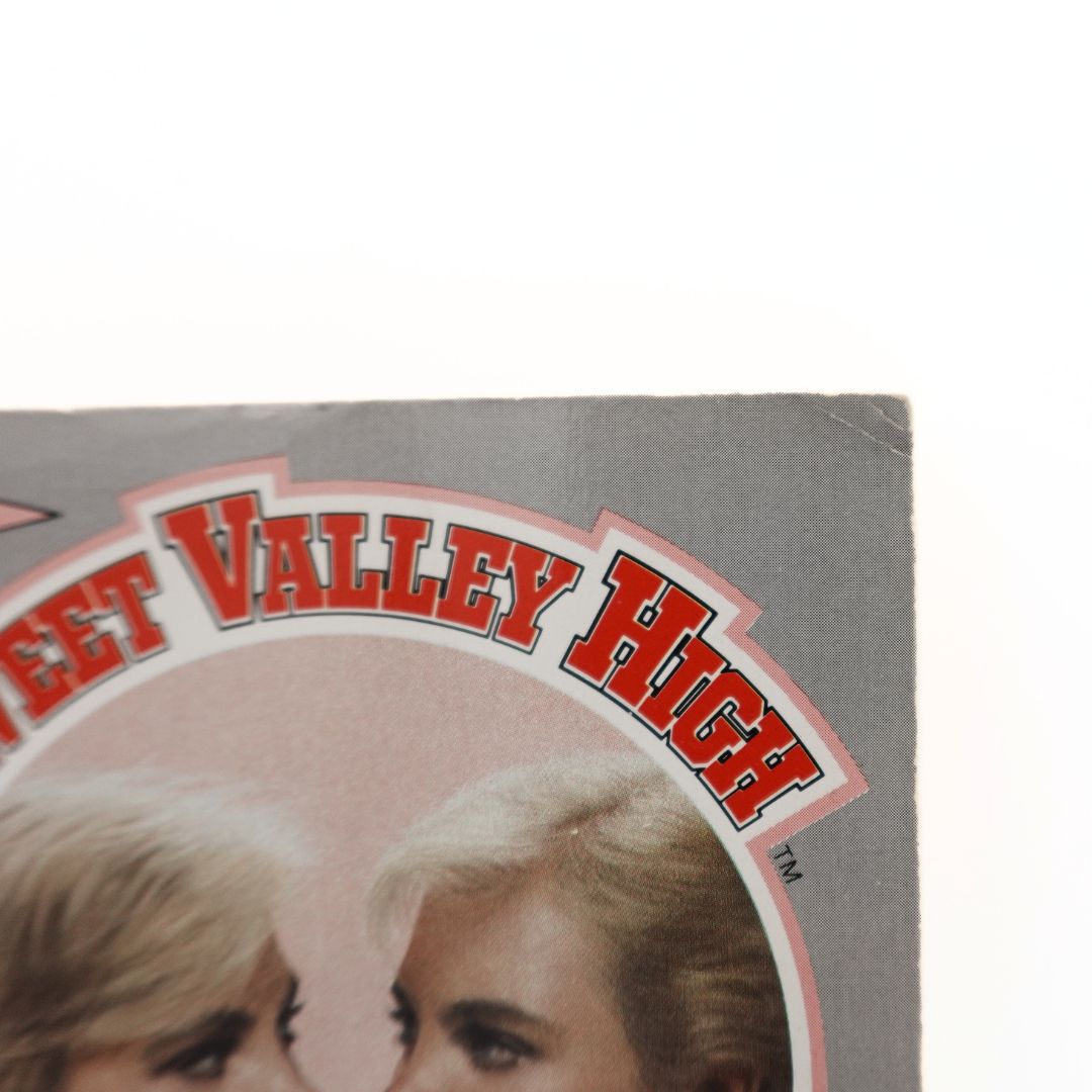 Corner of the Sweet Valley High cover with minor damage.