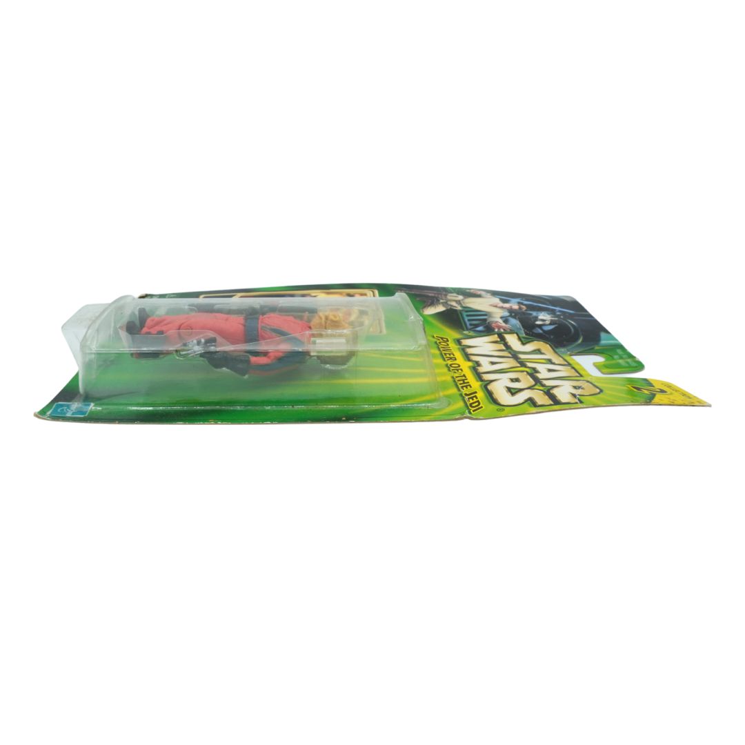 Toy figure in packaging with 'Star Wars' branding on a white background