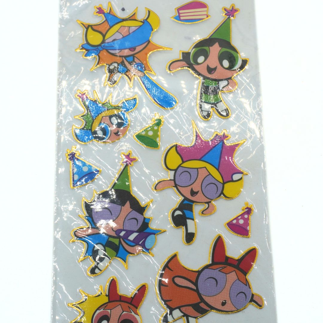 Cartoon character stickers with colorful hats on a clear background