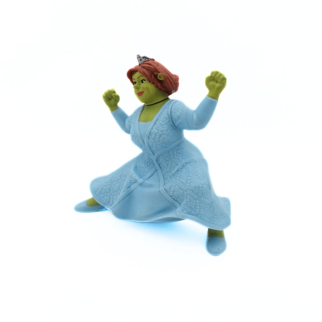 Front on photo of a 2007 McDonalds Shrek the Third Princess Fiona Figure with green skin, red hair and a blue dress