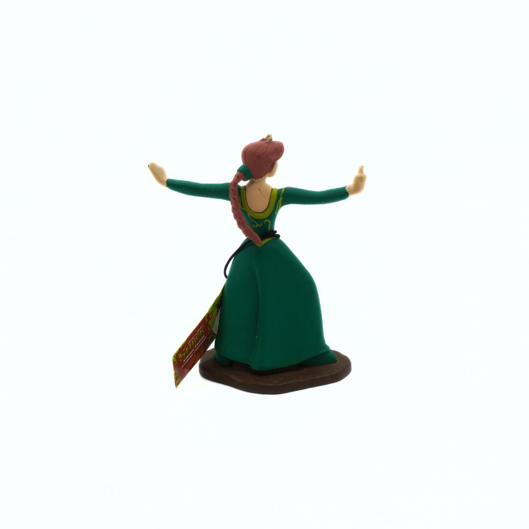 Figurine of a character in a green dress with arms outstretched on a white background