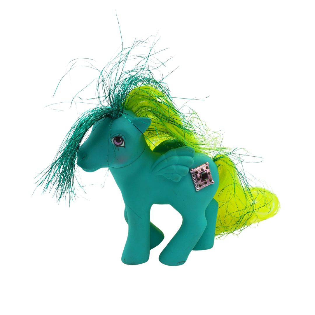 Teal toy horse with green and yellow hair on a white background