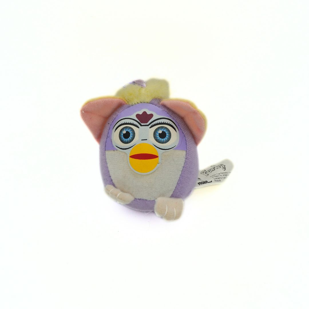 Plush toy with a purple face and yellow accents on a white background