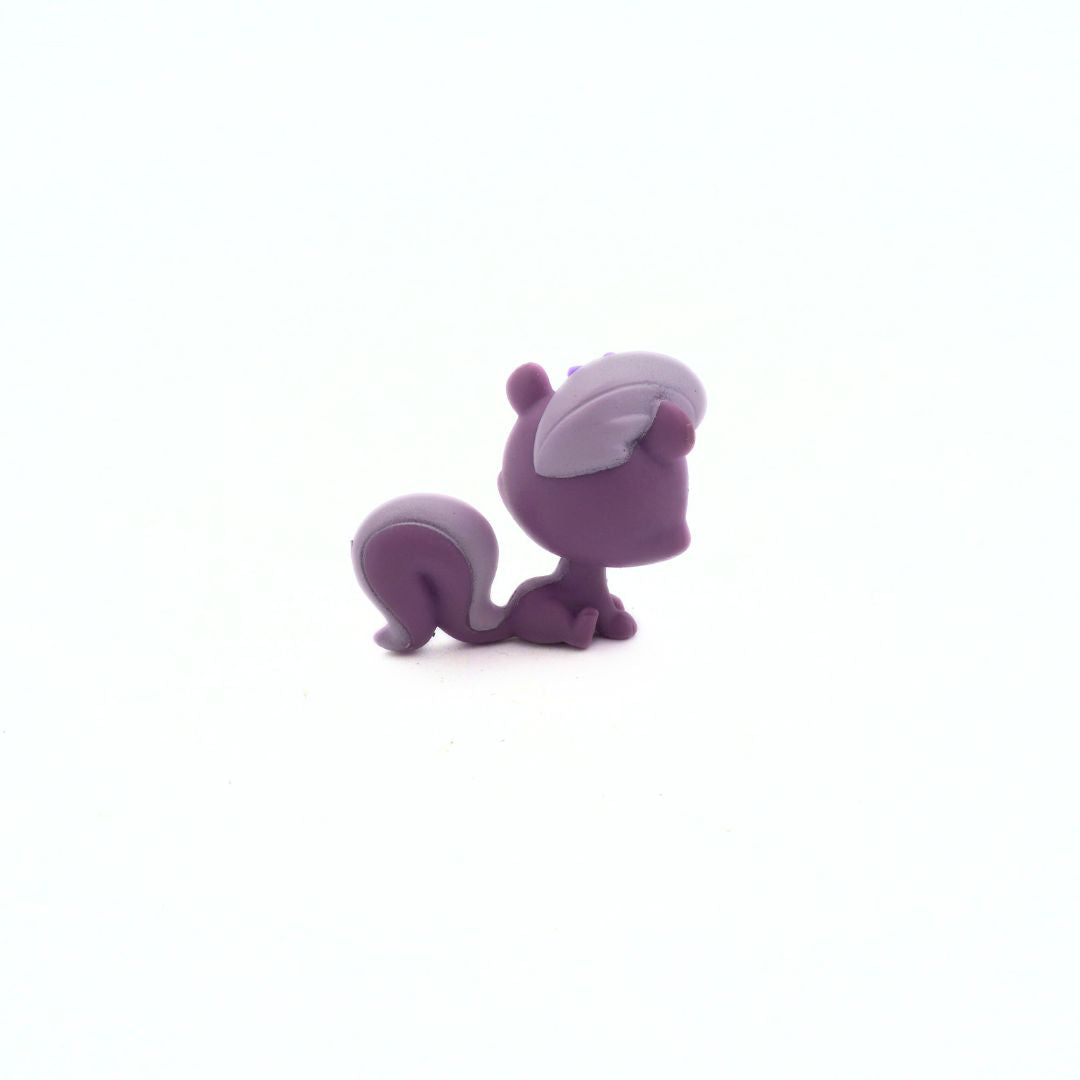 Purple cartoon-like creature on a white background
