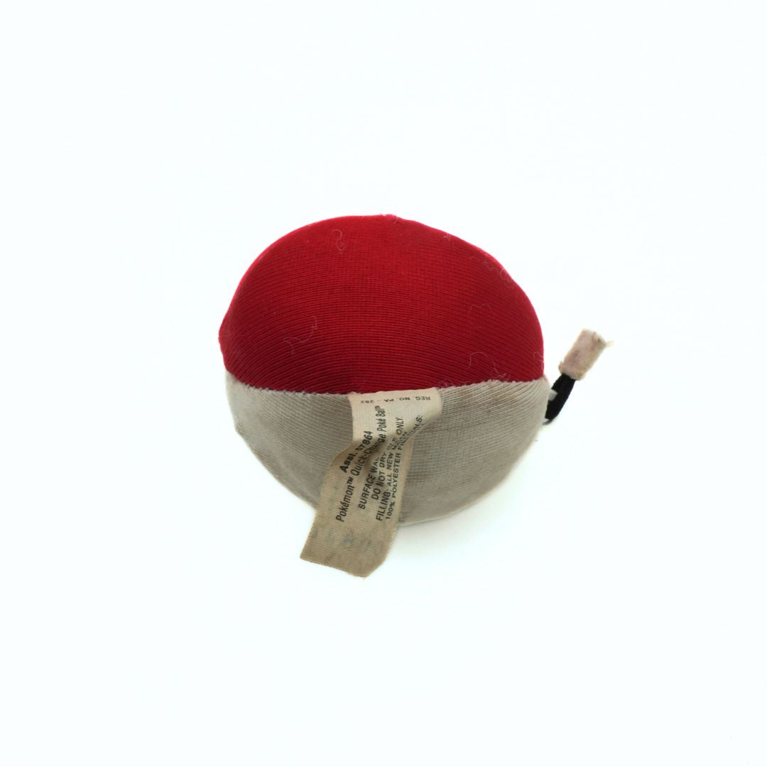 Red and gray fabric ball with a tag on a white background