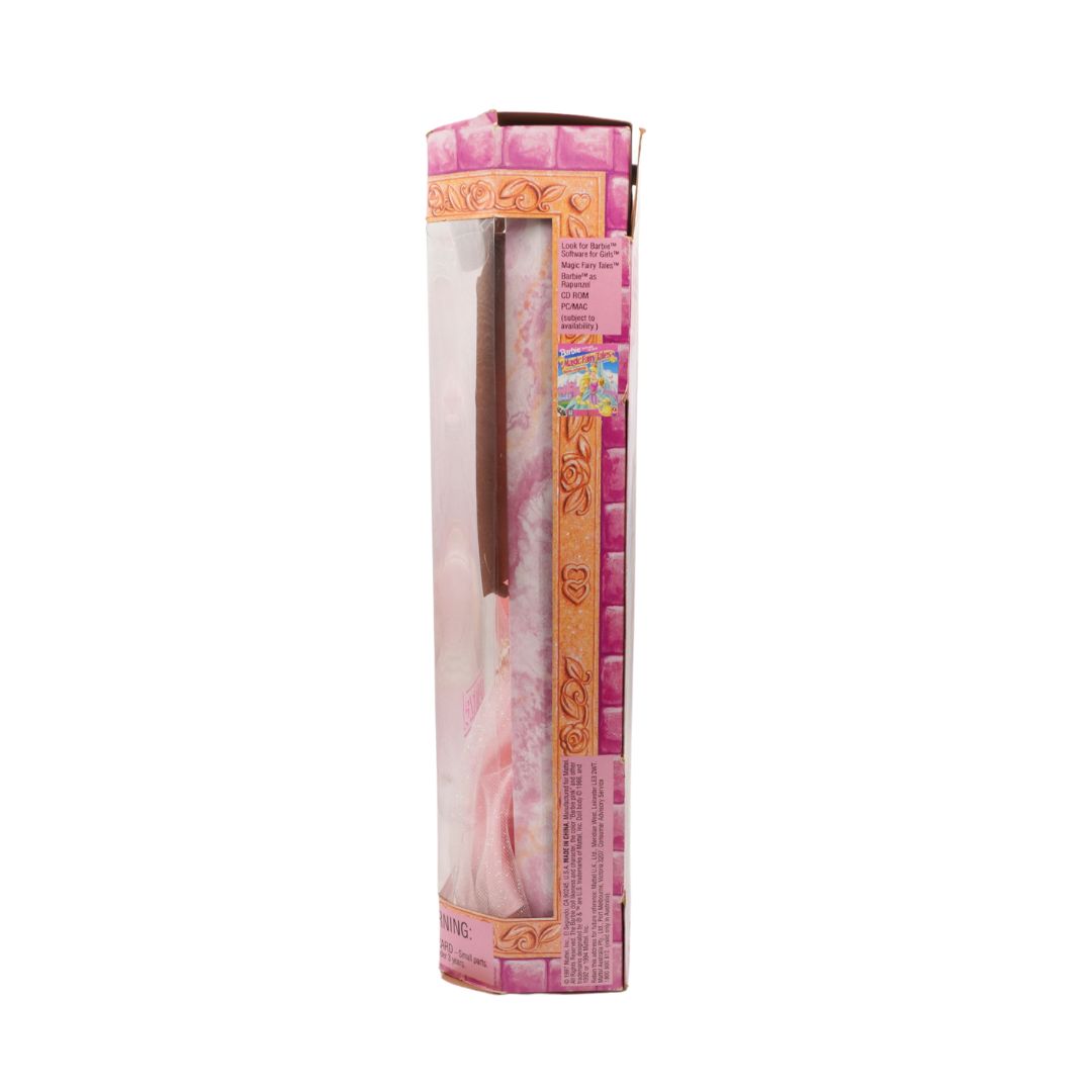 Pink and gold packaging with a pen inside on a white background