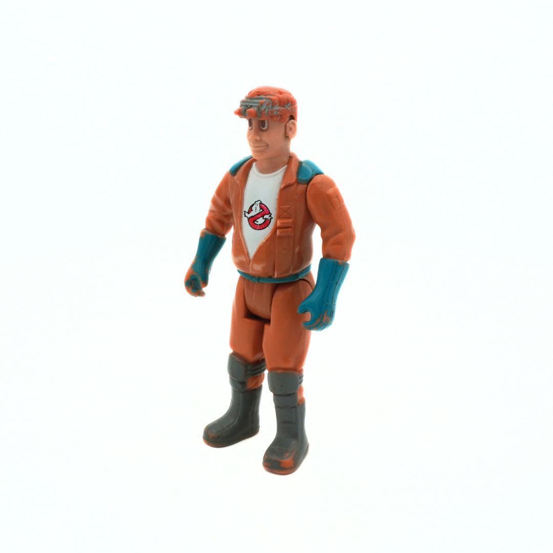 Action figure in orange and gray outfit with helmet on a white background