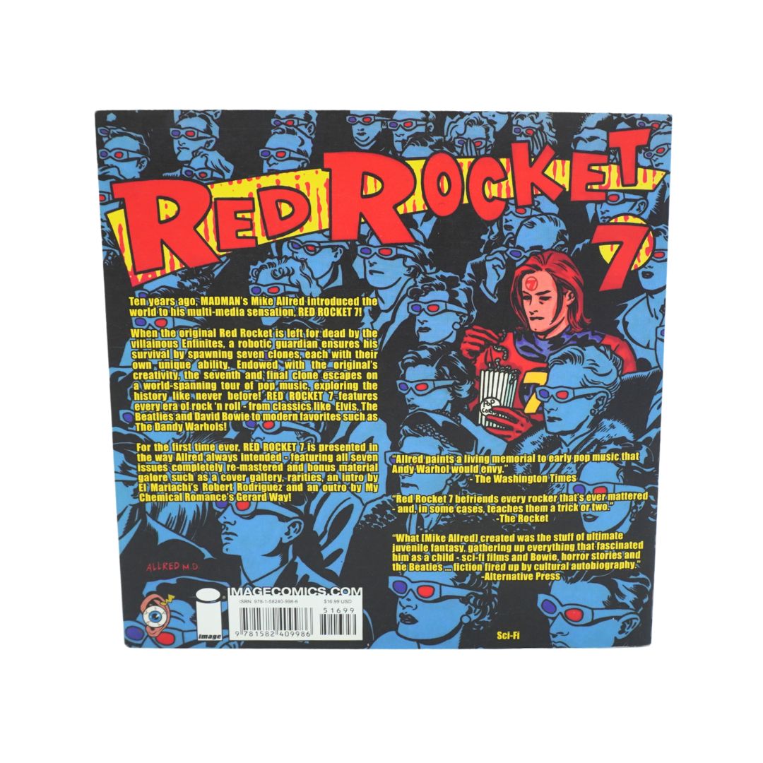 The back cover of a comic book or booklet titled 'Red Rocket #7' featuring a dark blue background filled with blue robot faces, large red and yellow title text, and a central illustration of a red-haired robot. A barcode and small logo are visible at the bottom.