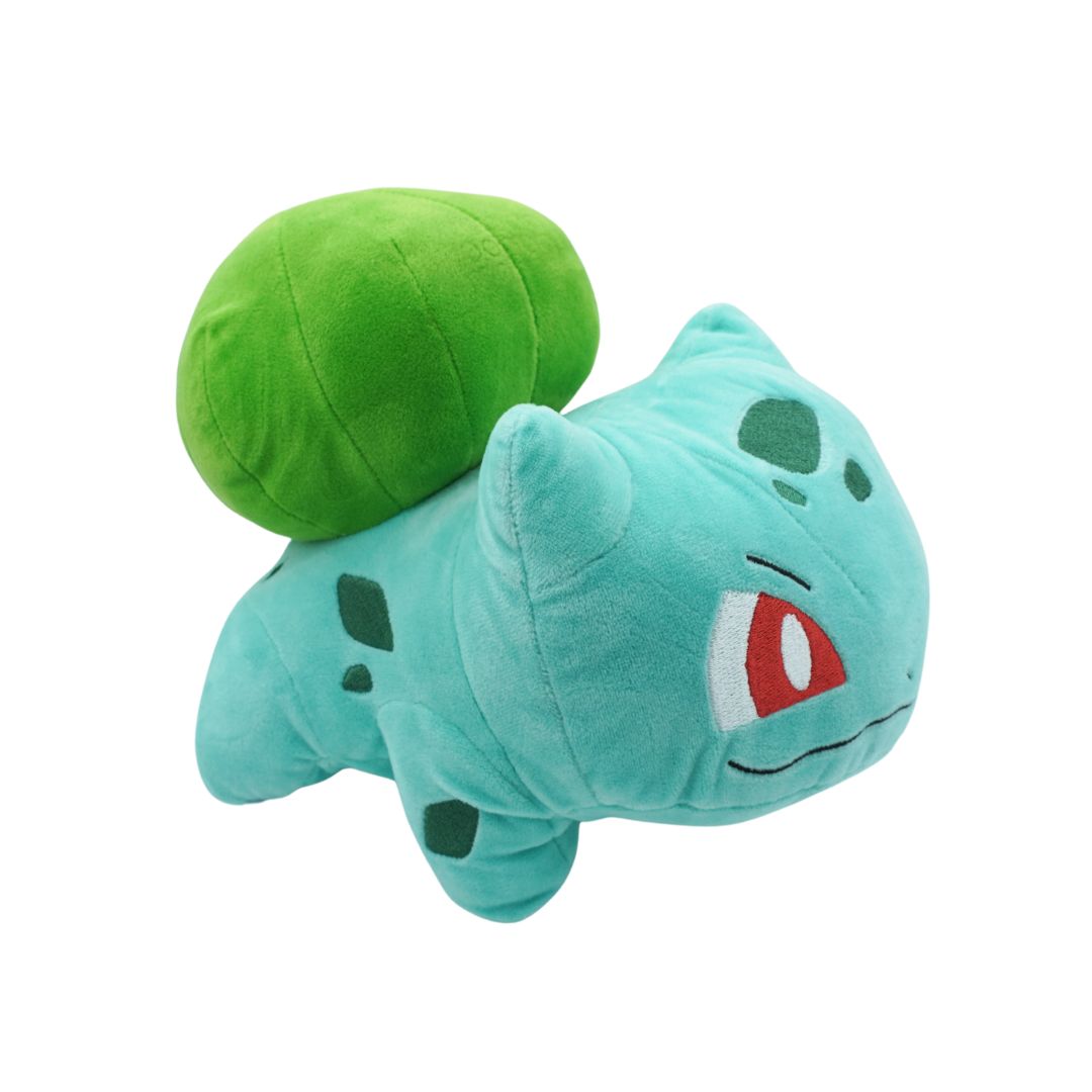 Plush toy of a green creature with a red eye on a white background