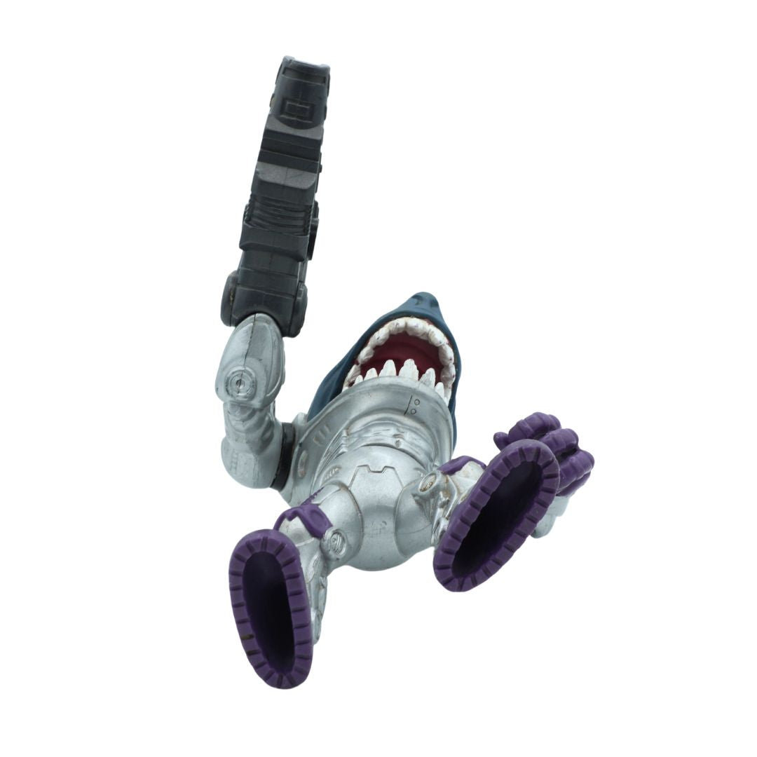 Toy figure of a shark with a strap on a white background
