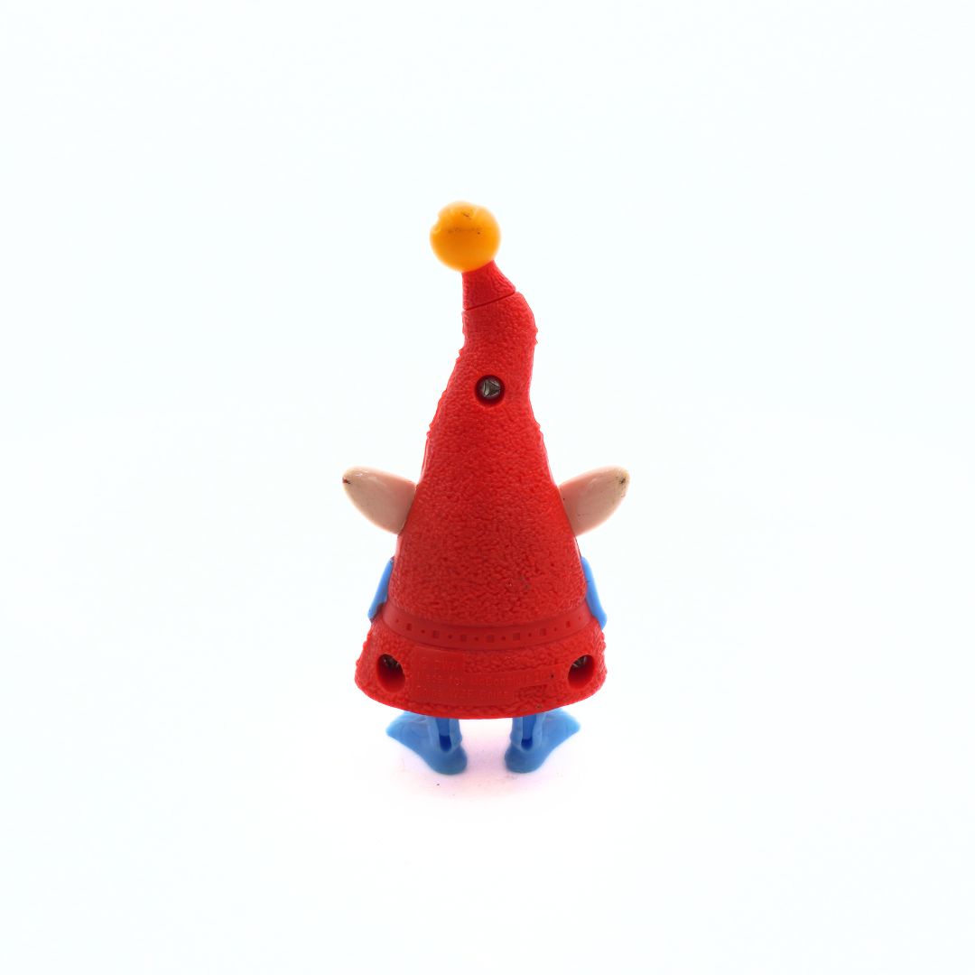 Small plastic toy with a red cone-shaped hat and blue shoes on a white background