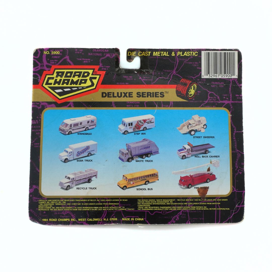 Packaged toy set with 'Road Champs' branding and illustrations of various vehicles.