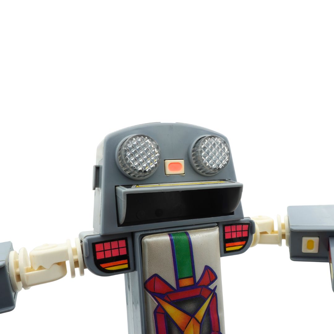 Toy robot with a colorful tie on a white background