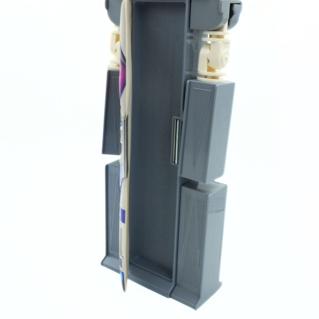 Gray electronic device with a white cord on a white background