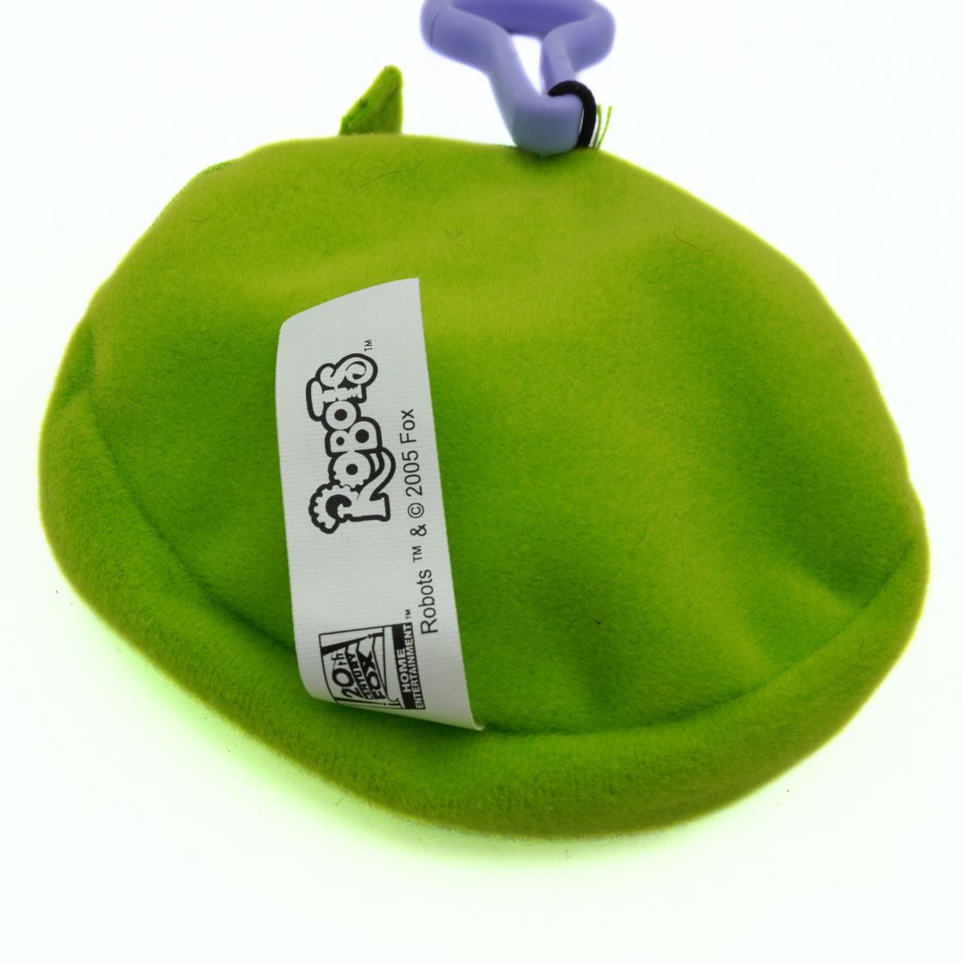 Green toy with a label on a white background