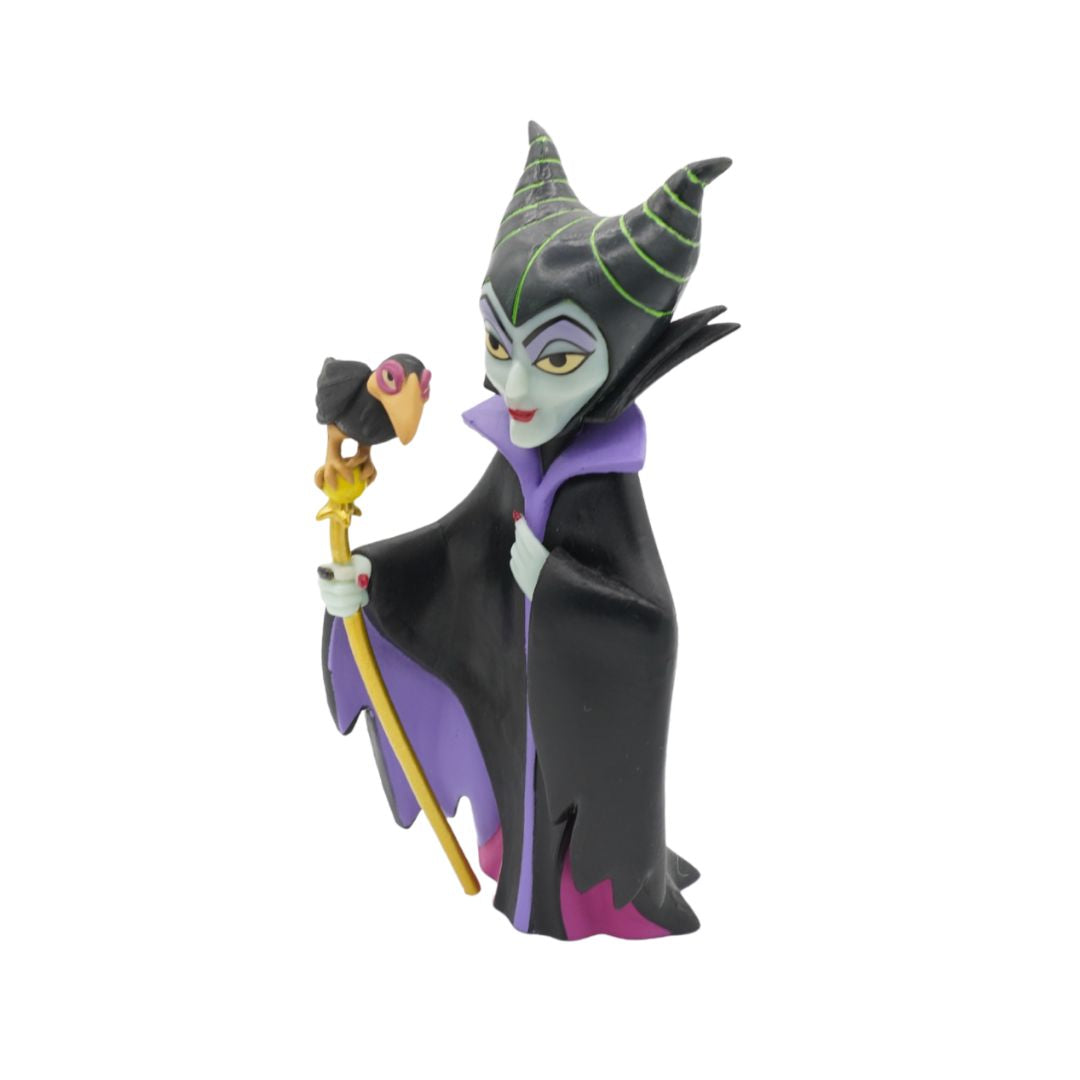 A collectible figurine of Maleficent from Disney's Sleeping Beauty. The figurine is set against a solid white background.