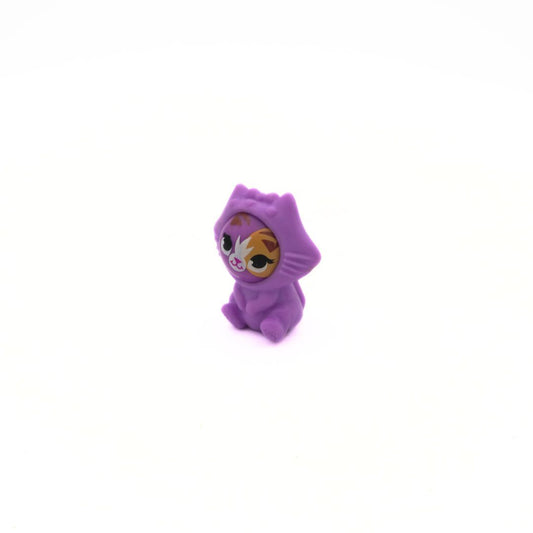 Small purple character figurine with a hood on a white background