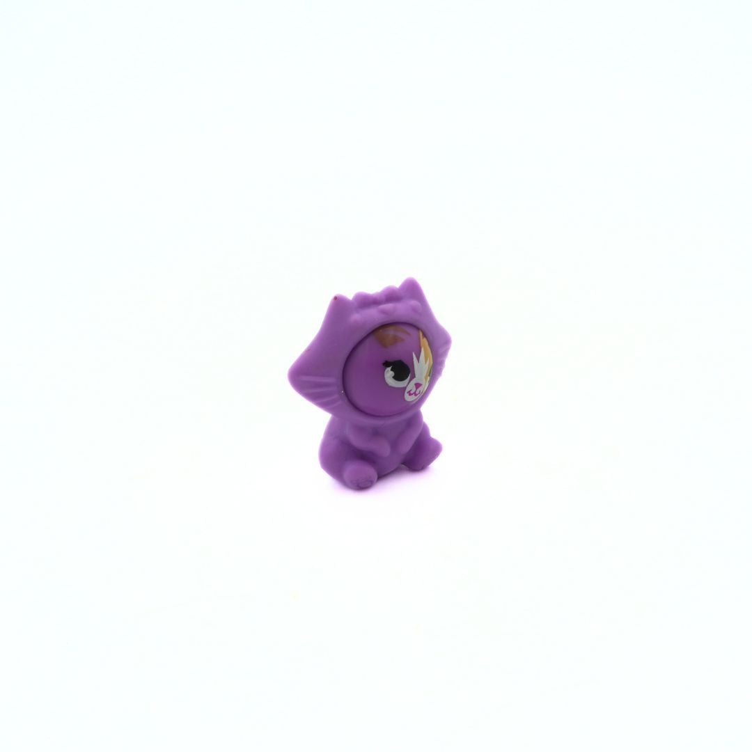 Small purple toy figure on a white background