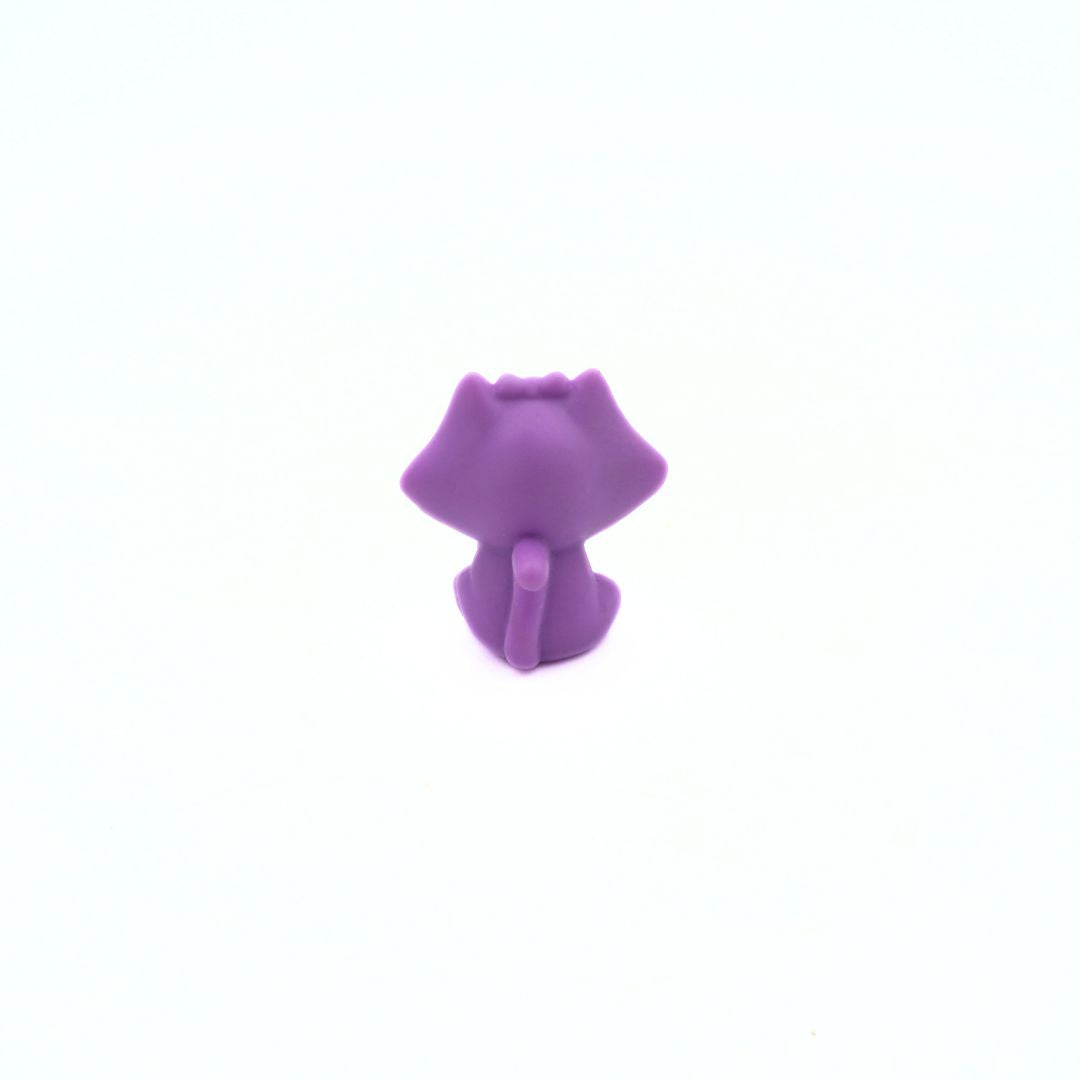 Purple cat-shaped object on a white background