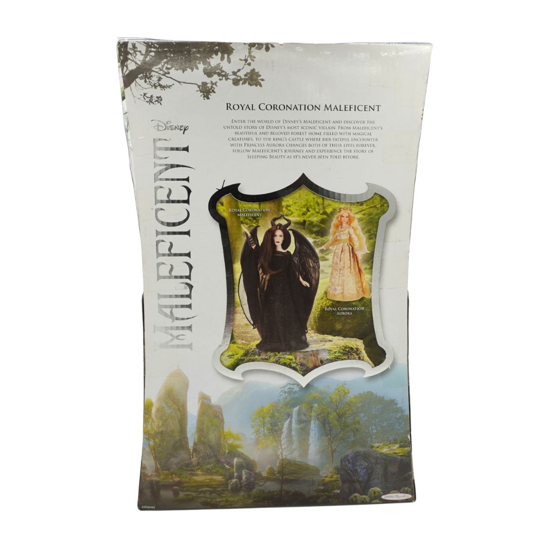 Disney Maleficent Royal Coronation Maleficent packaging card featuring artwork of the character in a black robe with a golden crown, set against a scenic green landscape background.