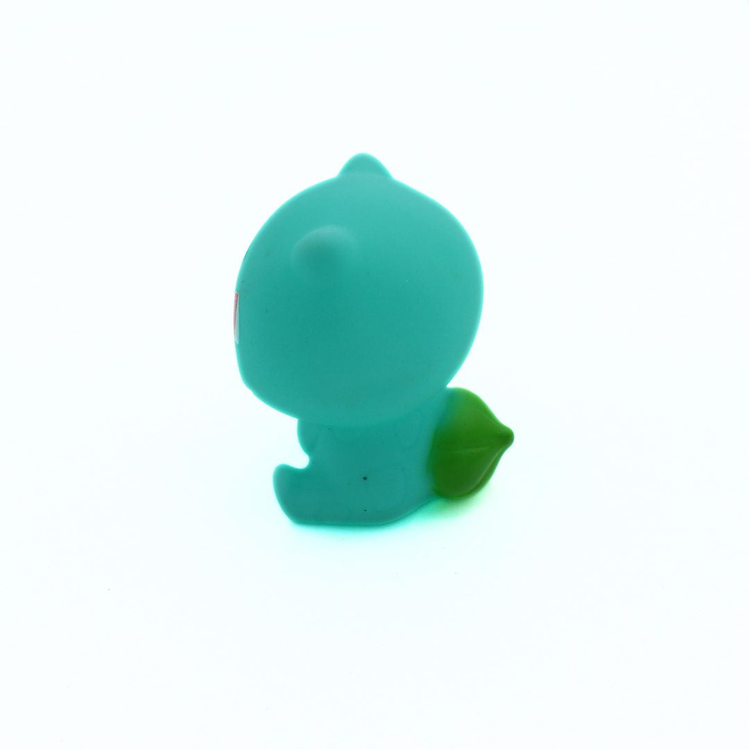 Green rubber duck on a white background
