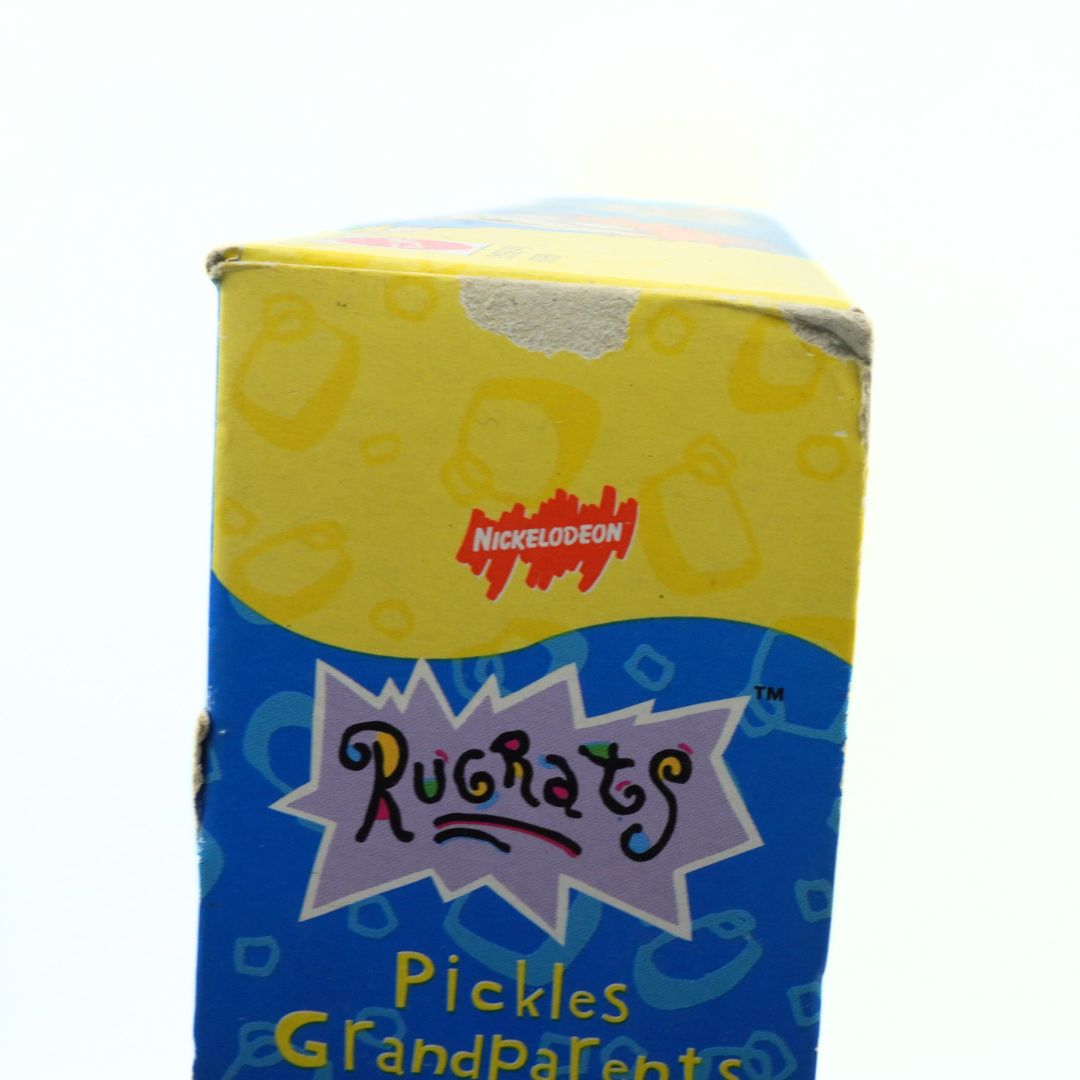 Cartoon character-themed product packaging with 'Nickelodeon' and 'Rugrats' branding on a white background.