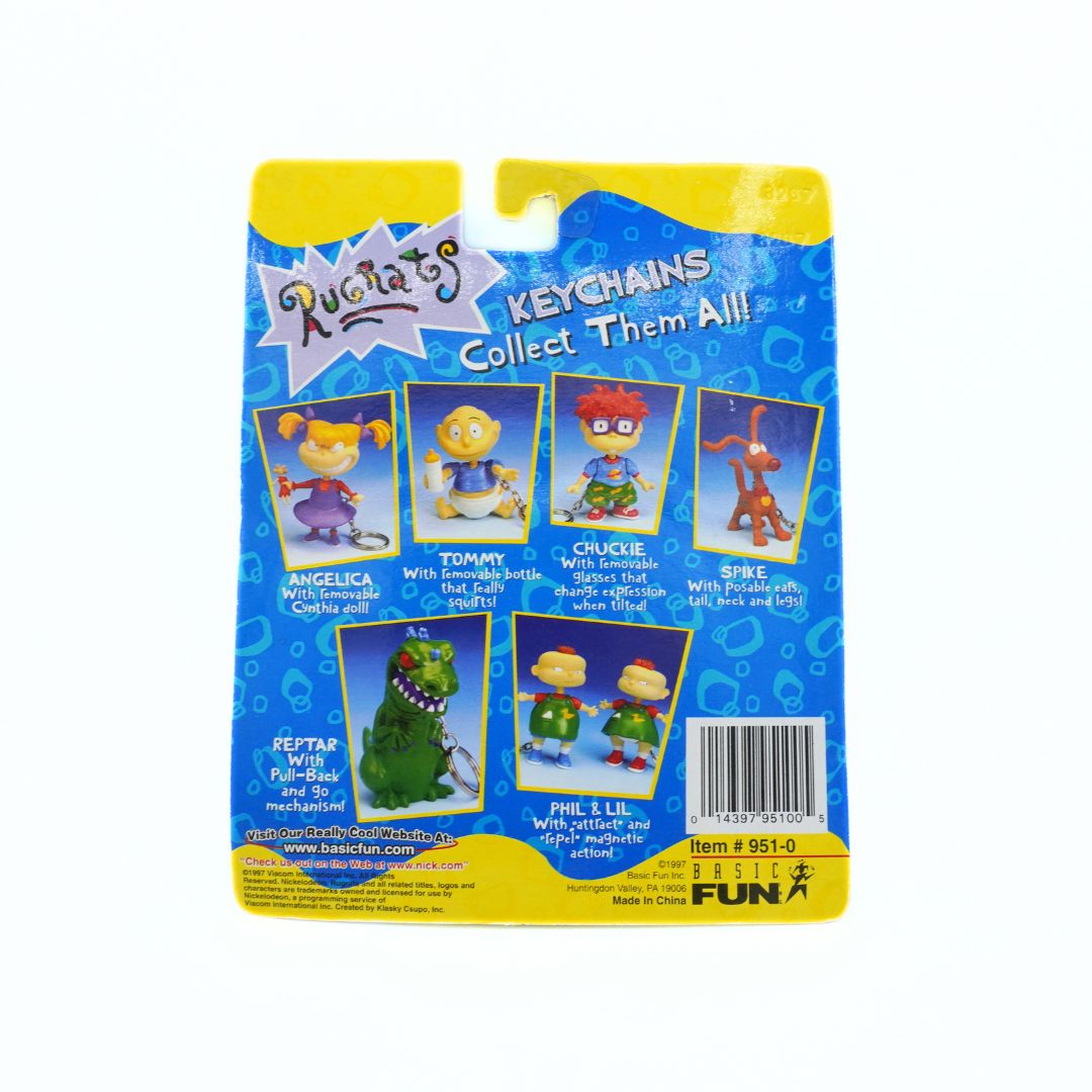 Packaged keychains with cartoon characters on a white background