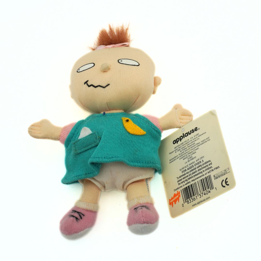 A vintage 1999 Nickelodeon Lil Deville plush from the Rugrats wearing a green shirt with pink shoes
