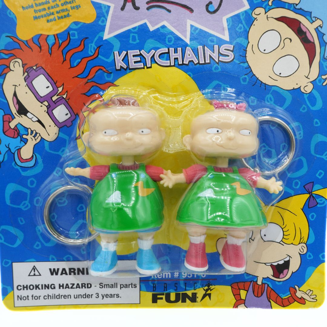 Keychains with cartoon characters on a colorful packaging
