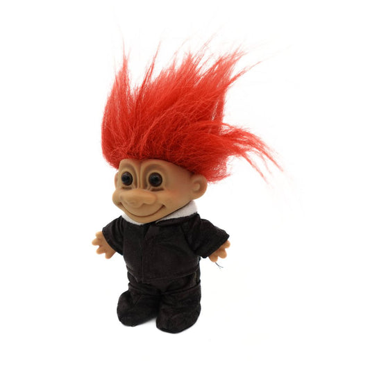 A photo of the 90s Russ Troll Doll Pilot in a dark brown outfit with orange hair