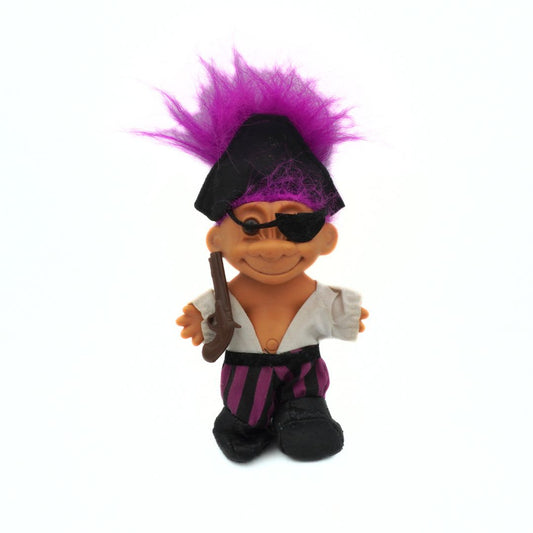 Pirate-themed doll with purple hair, eyepatch, and sword on a white background