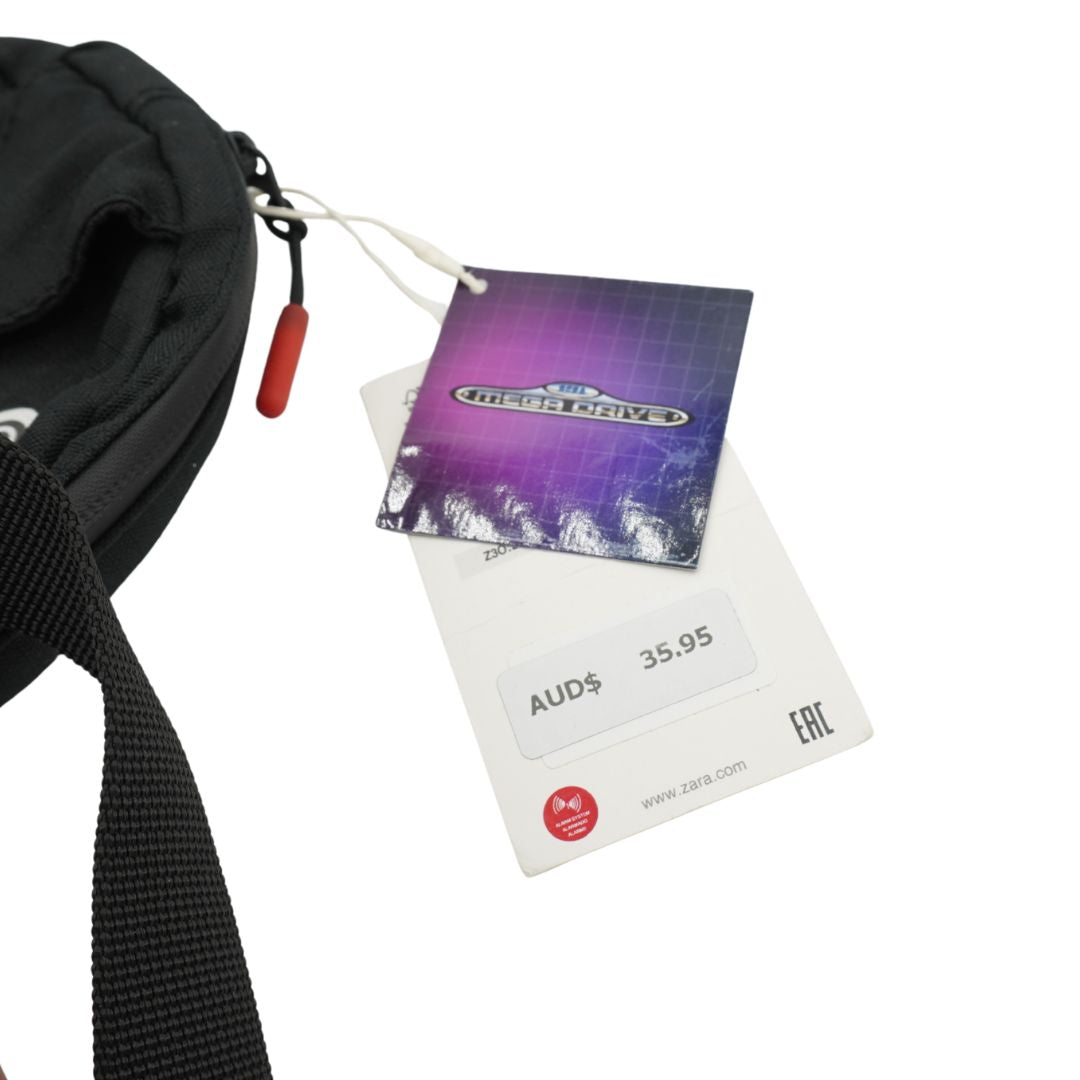 Zara and SEGA tags on a vintage black bag