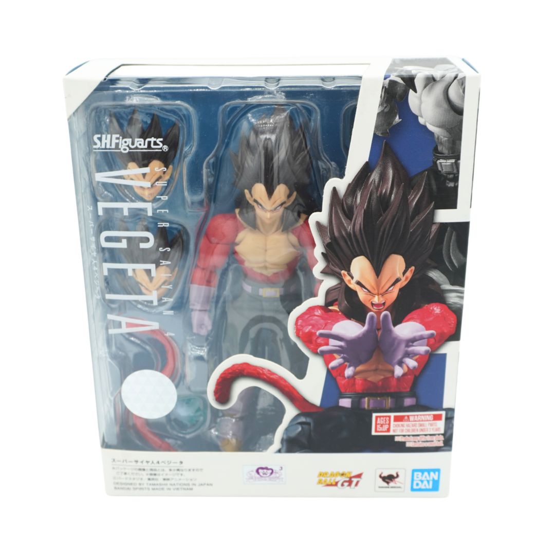 A front on photo of a Dragon Ball Vegeta character with black hair and a red shirt in a blue and white box on a white backdrop
