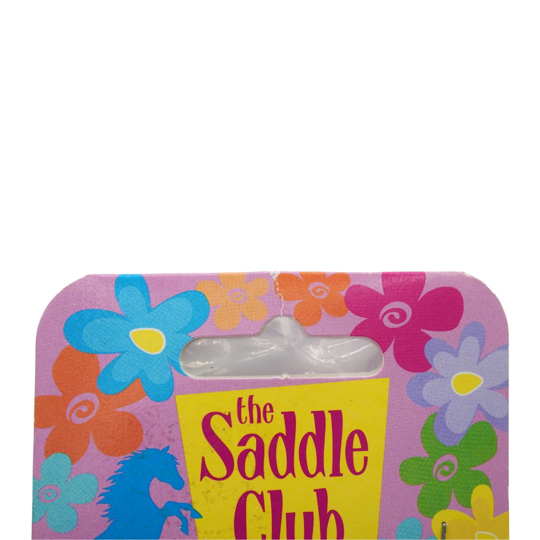 Floral packaging with 'The Saddle Club' branding on a white background