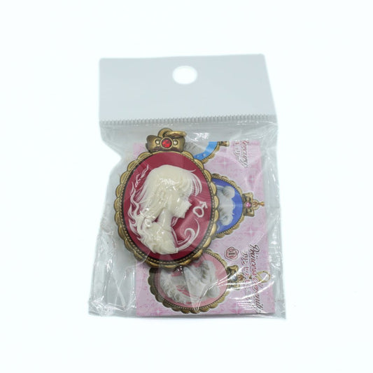 Packaged Sailor Mars charm with a cameo design on a white background